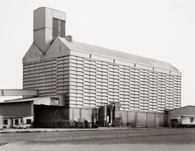 Black and white photograph of grain elevator exterior