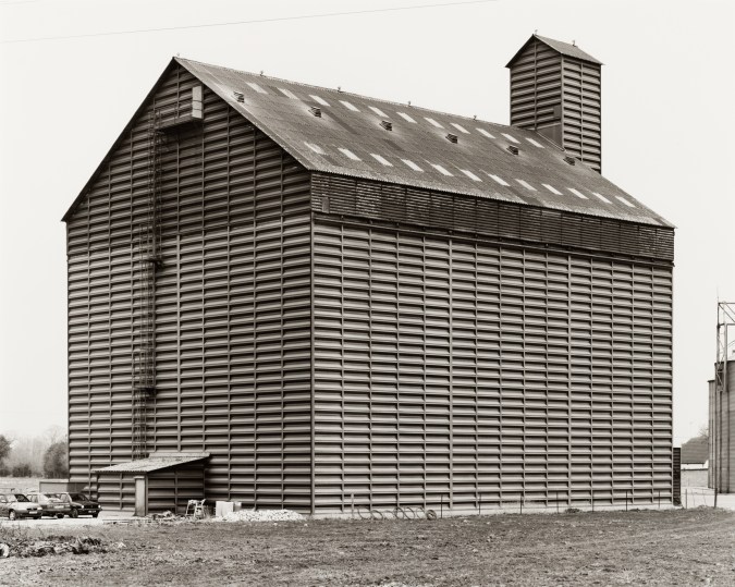 Black and white photograph of the exterior of a grain elevator
