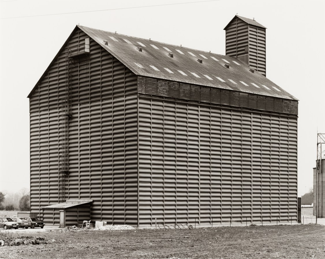 Black and white photograph of the exterior of a grain elevator