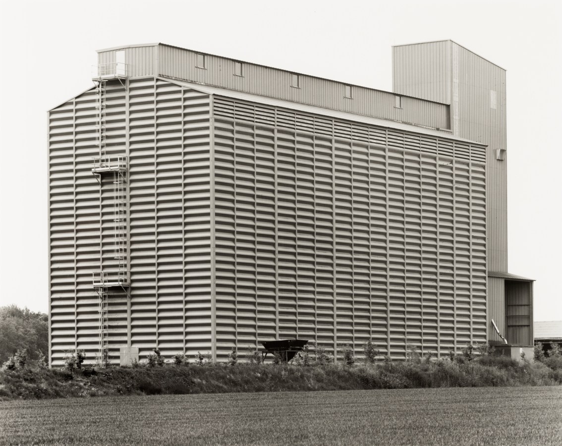 Black and white photograph of the exterior of a grain elevator