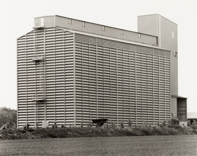 Black and white photograph of the exterior of a grain elevator