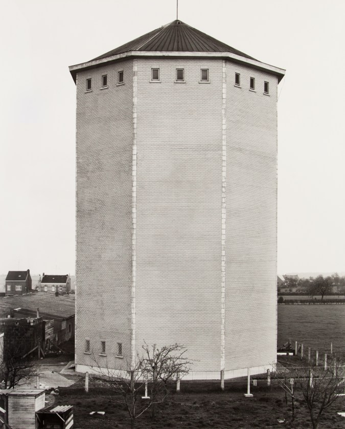 Black and white photograph of a water tower exterior