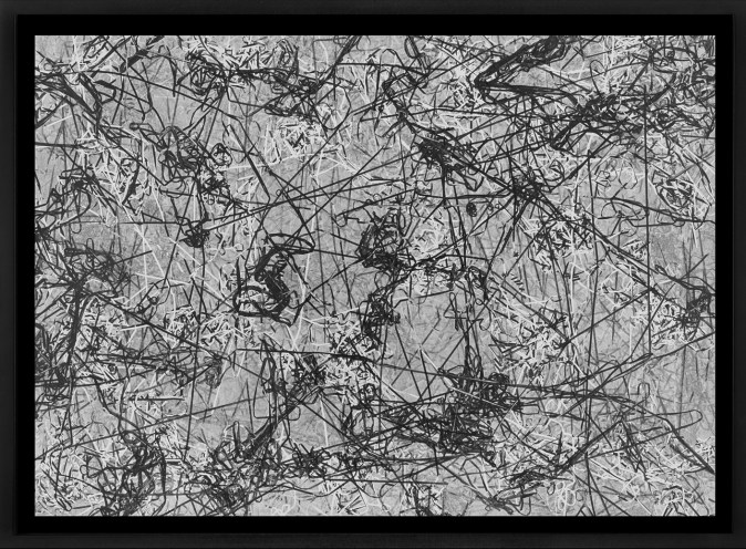 Black and white photograph of outlines of tangled cassette tape