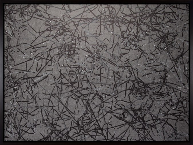 Black and white photograph of outlines of tangled cassette tape