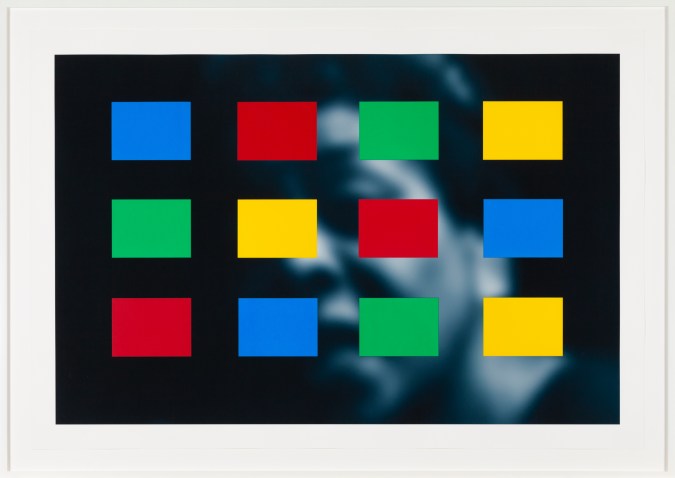 Framed artwork showing a soft-focus blue-toned portrait overlayed with blue, yellow, green, and red color blocks.