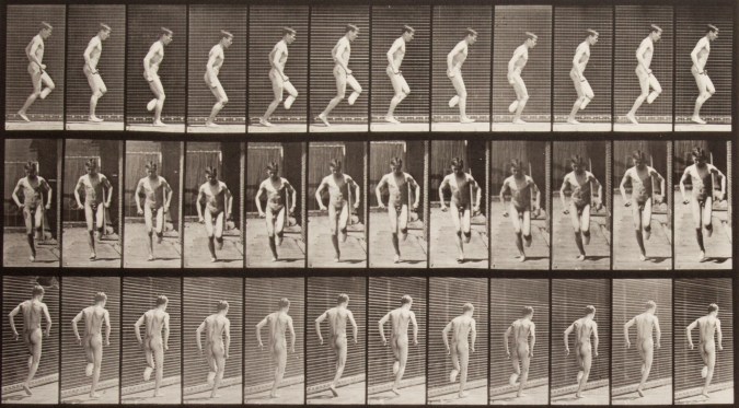 Three rows of small black and white photographs of a nude man hopping on his foot.
