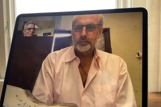 Two people on a video chat on an iPad