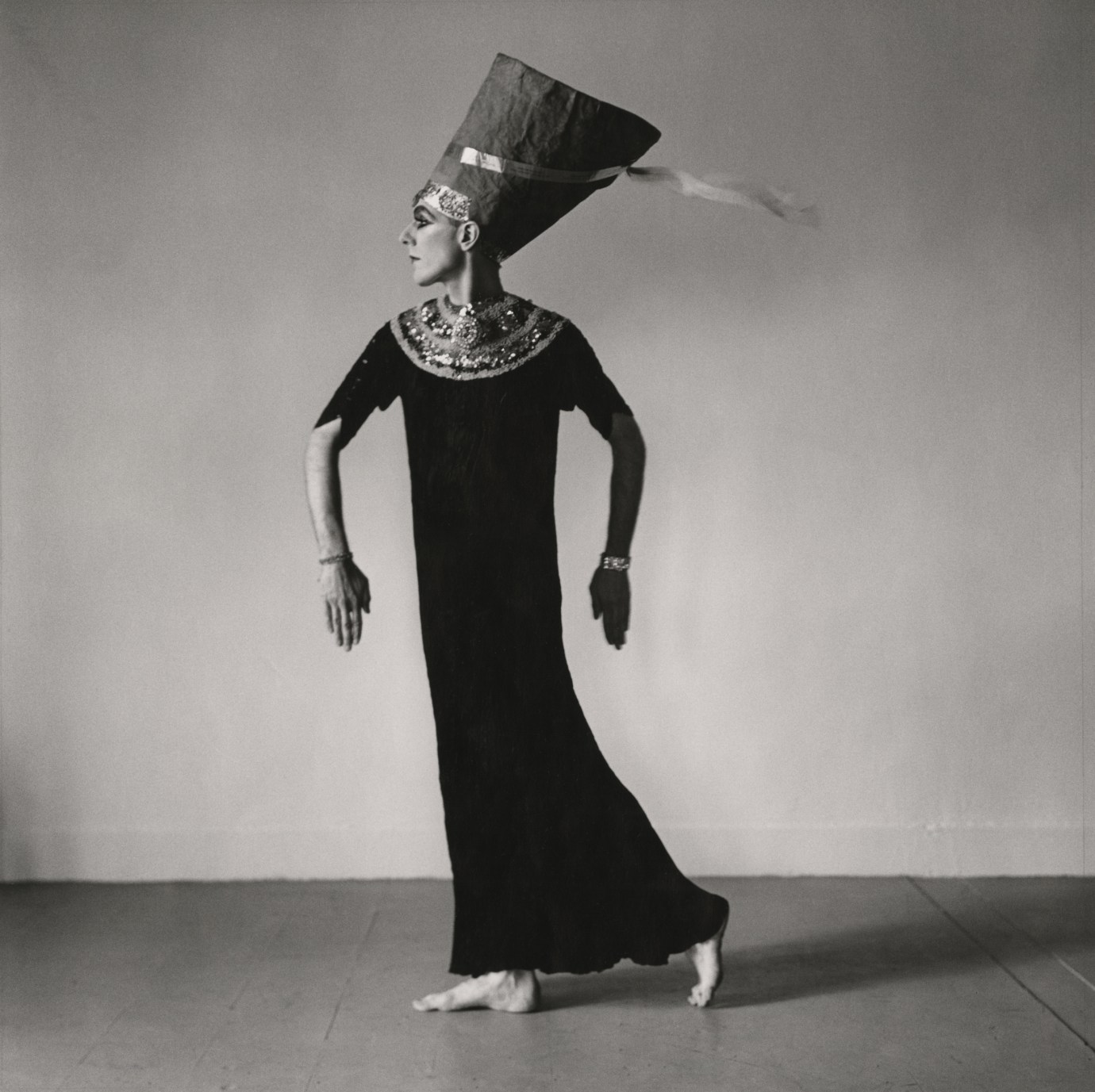 Black and white photograph of female impersonator in costume as Nefertiti