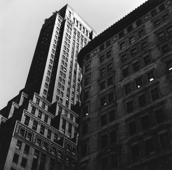 Black and white photograph of buildings in New York shot from the street