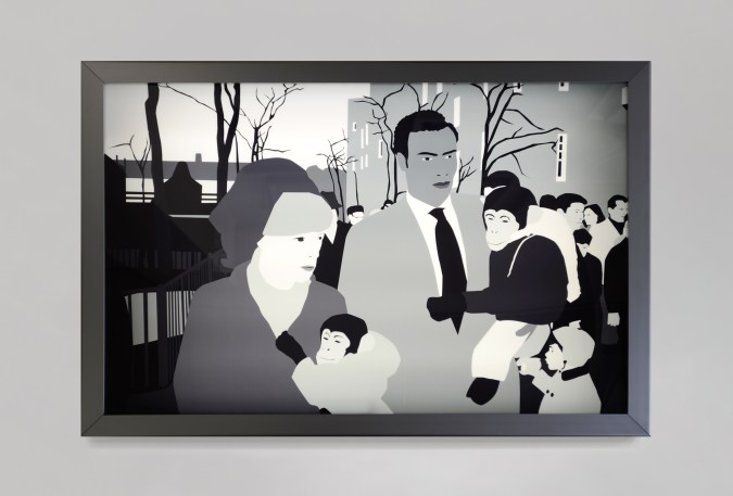 Color image of a black and white transparency on a light box depicting two figures with pet monkeys in clothes walking through the park