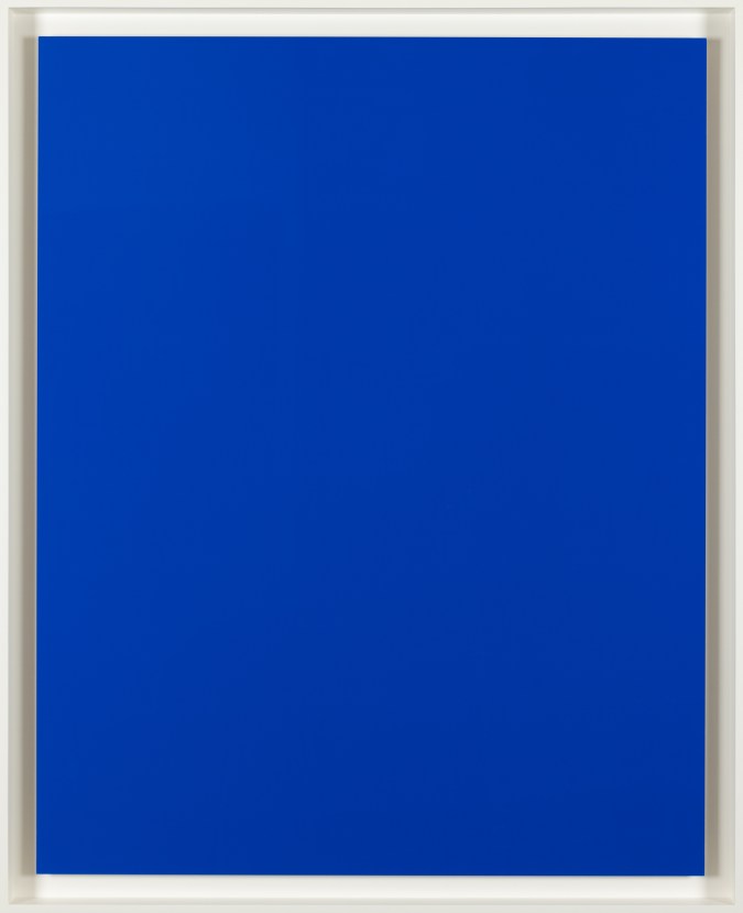 An image of a solid blue colored print in a white frame.