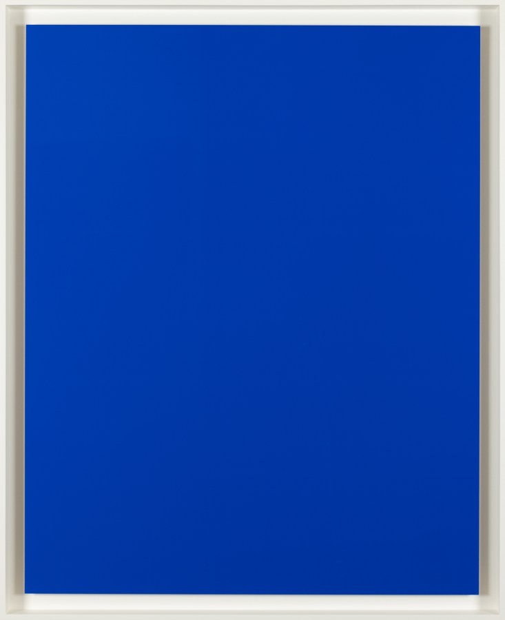 An image of a solid blue colored print in a white frame.