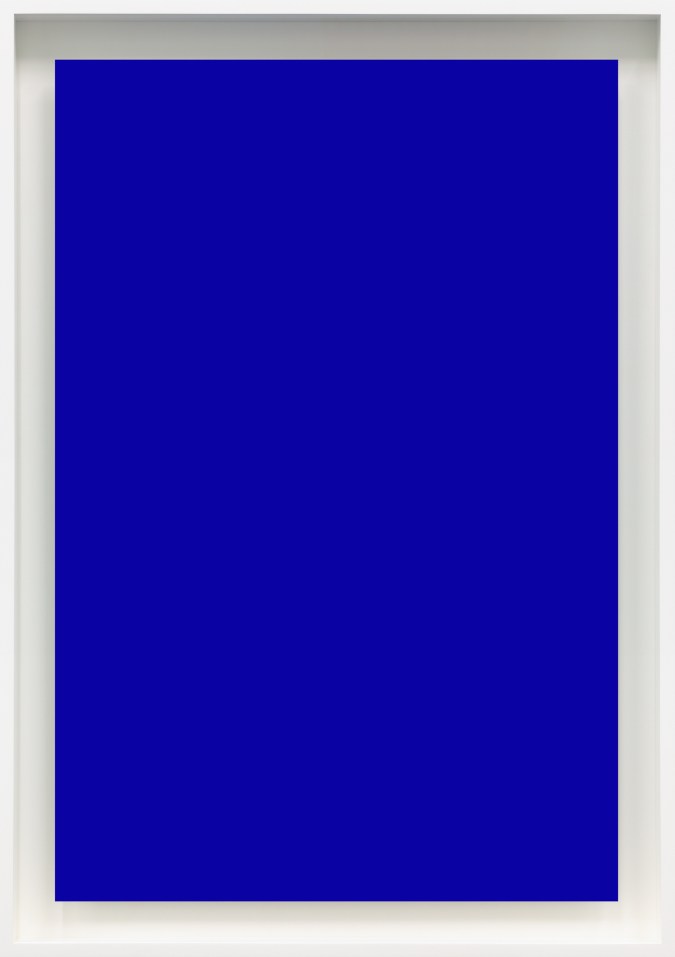 Color image of a blue photogram framed in white