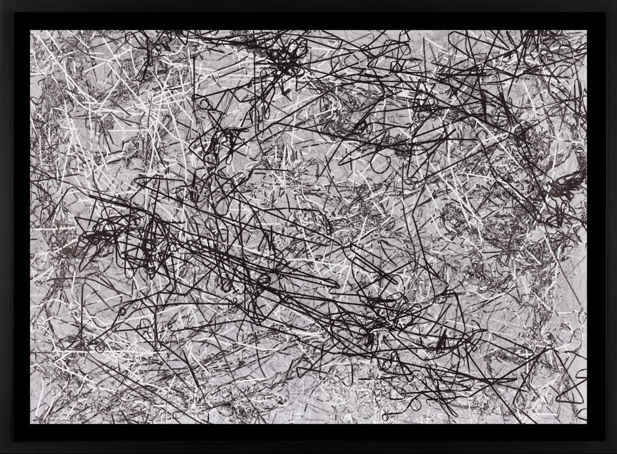 A framed abstract monoprint, of a pile of tape pulled from a casette