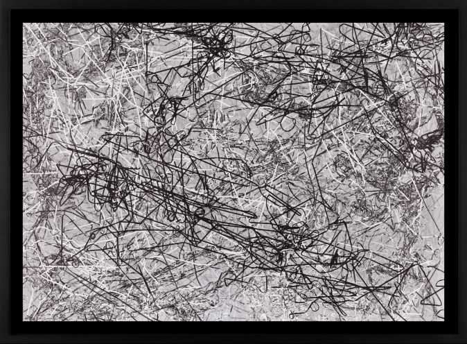 A framed abstract monoprint, of a pile of tape pulled from a casette