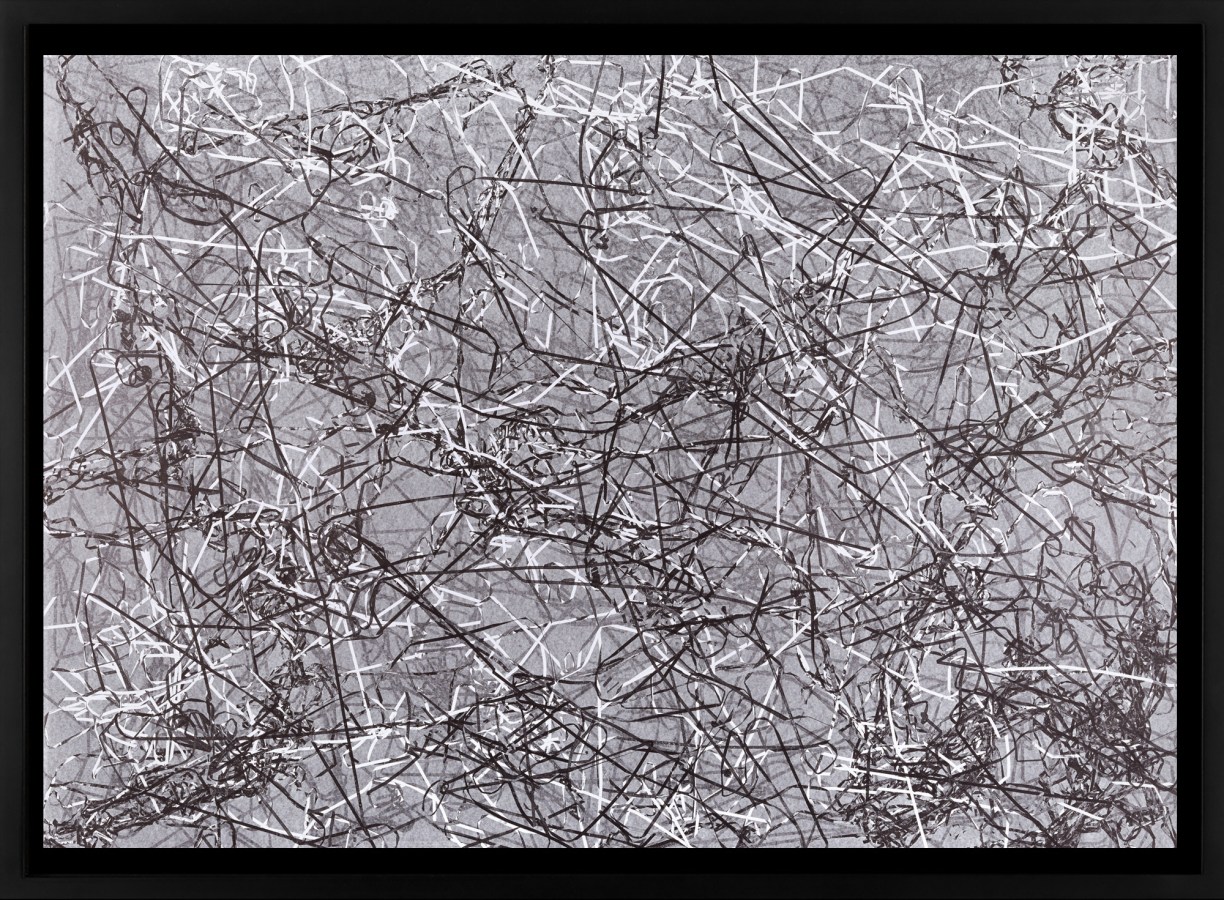 Black and white photograph of outlines of tangled cassette tape