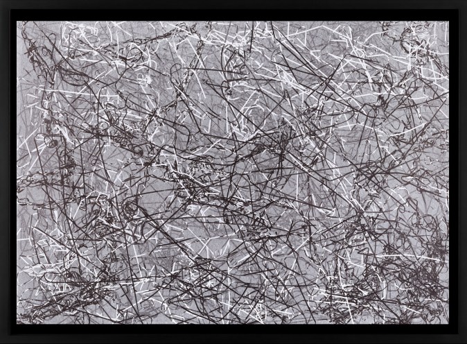 Black and white photograph of outlines of tangled cassette tape