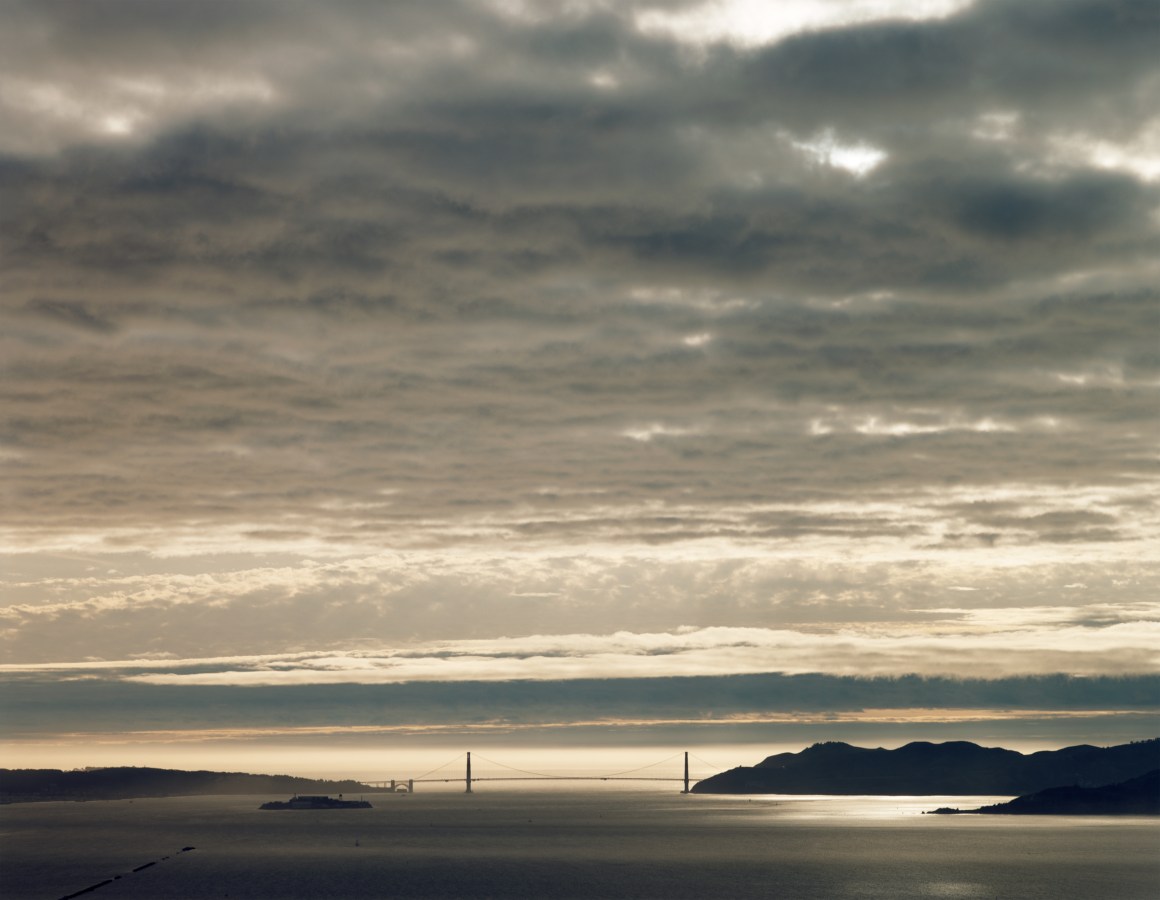 Color photograph of clouds over the Golden Gate Bridge