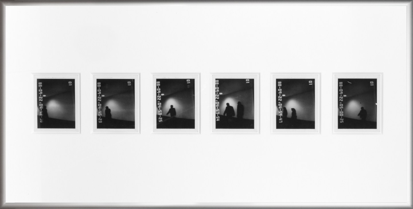 Color image of six black and white polaroids with time stamps depicting shadowy figures in silver frame