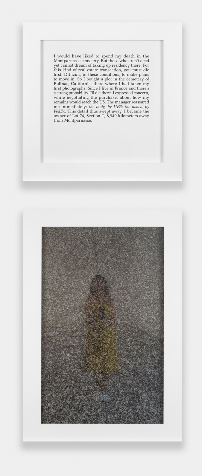 A square framed text panel hanging over a framed photograph of the photographer's reflection in the surface of a headstone