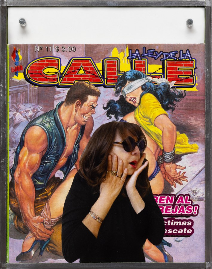 Color image of a comic book encased in a glass and metal frame with a collaged image over the cover