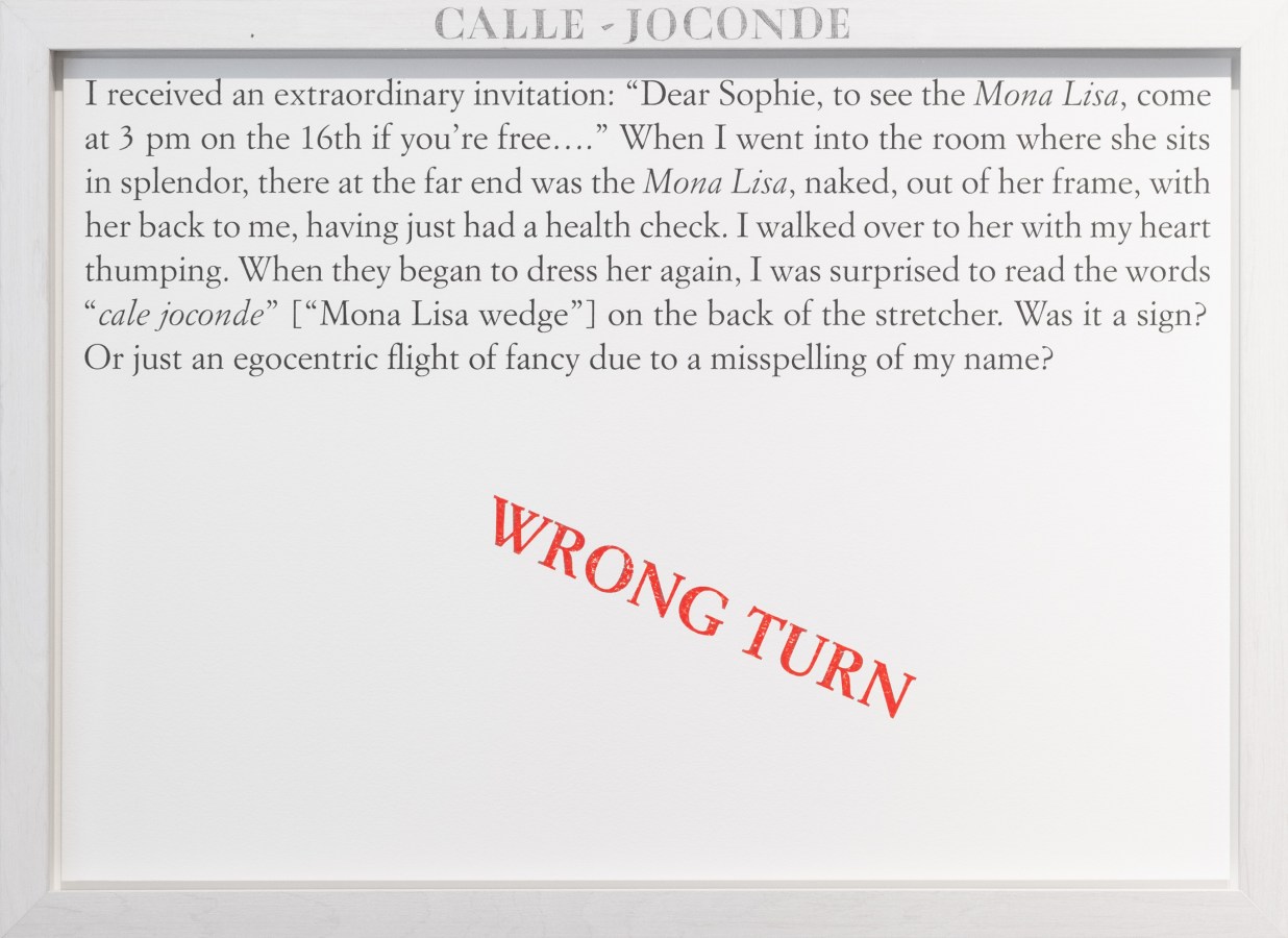 Color image of a white framed text panel with a red stamp of text reading 'Wrong Turn'