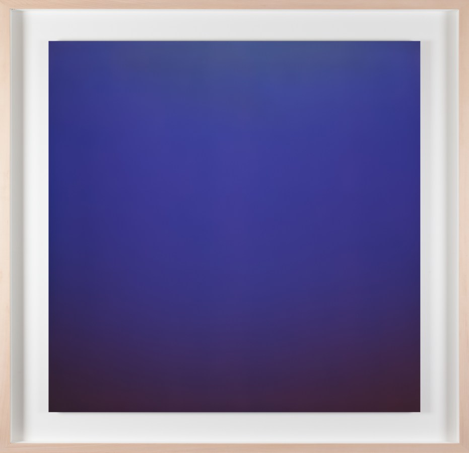 Vertical photograph of a blue color field, with a black bottom edge