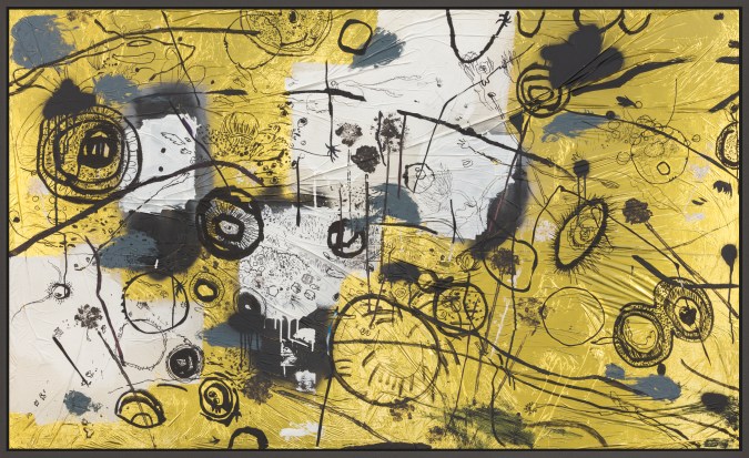 Color image of a mixed media artwork depicting swatches of black, white, and grey with abstract flowers and eyes with gold reflective material framed in grey