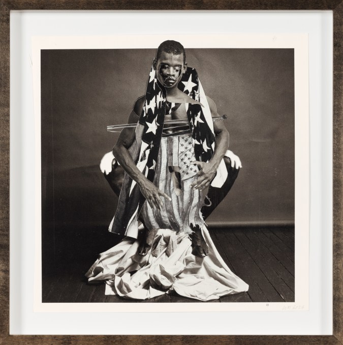 A black and white collage with a figure in the center draped in an American flag