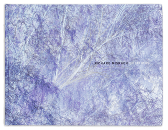 Color image of book cover with full bleed image of a color reversal of tree branches